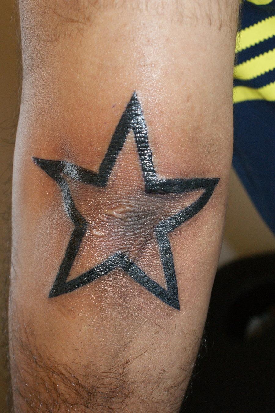 Black Outline Star Tattoo On Left Elbow For Men