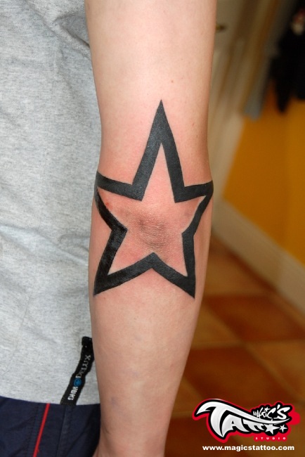 Black Outline Star Tattoo On Left Elbow