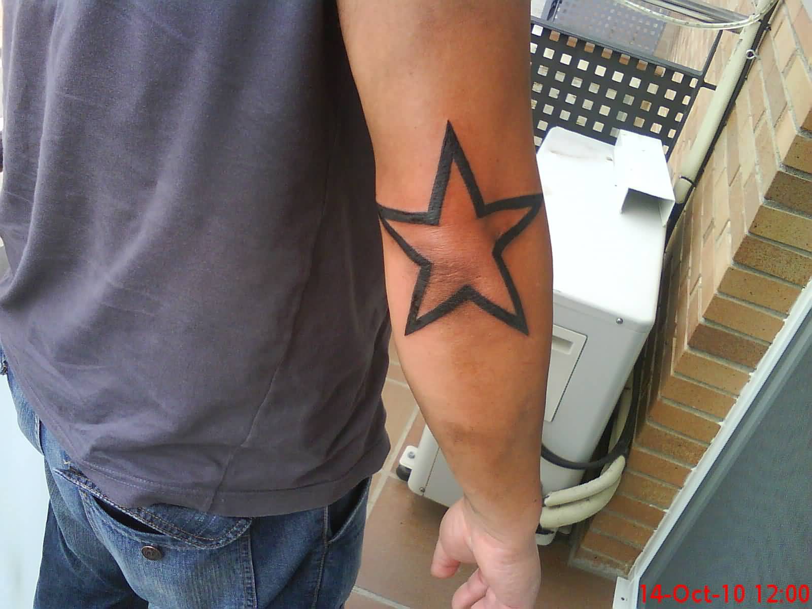Black Outline Star Tattoo On Right Elbow