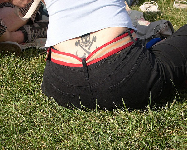 Black Pirate Symbol Tattoo On Lower Back