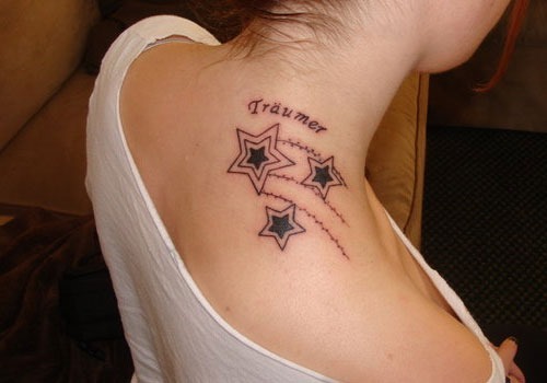 Black Star Tattoo On Girl Back