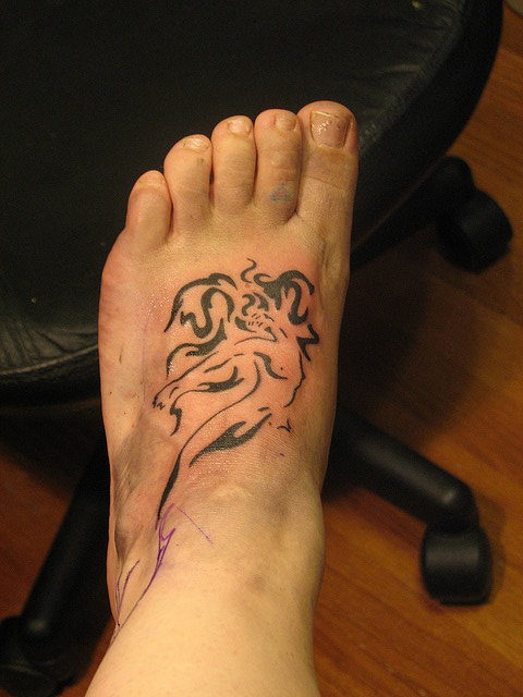 Black Tribal Mermaid Tattoo On Left Foot