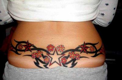 Black tribal And Star Tattoos On Lower Back