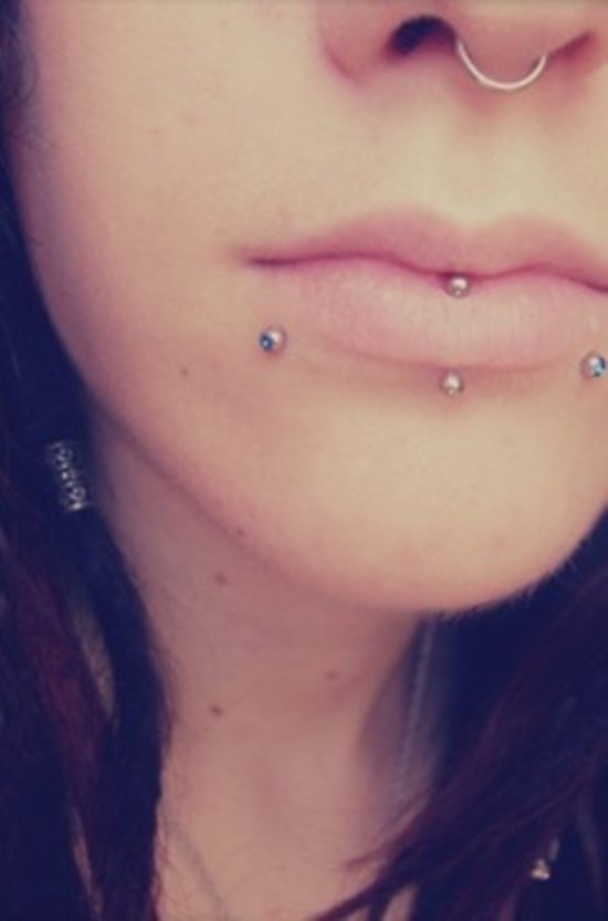 Canine Bites And Labret Piercing With Silver Barbell