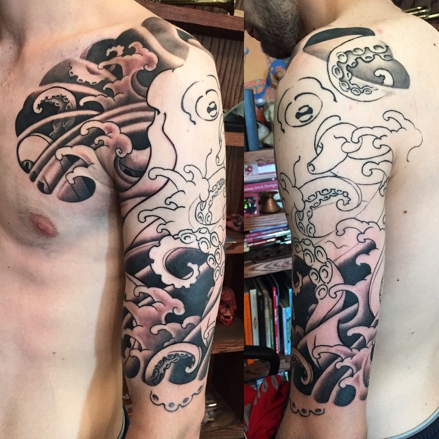 Classic Black Ink Octopus Tattoo On Man Left Half Sleeve