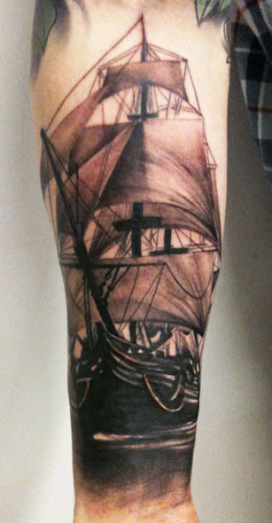 Classic Black Ink Pirate Ship Tattoo On Right Forearm