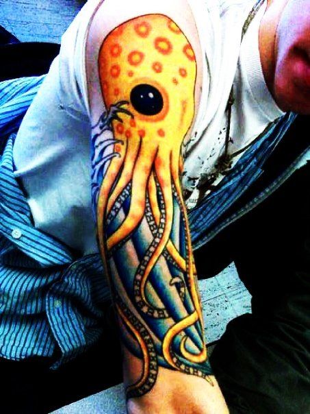 Classic Yellow Ink Octopus Tattoo On Man Right Half Sleeve