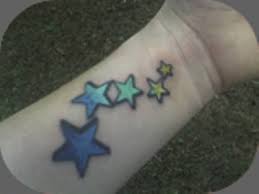 Colored Star Tattoo On Left Wrist