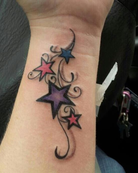Colored Star Tattoos On Left Forearm For Girls