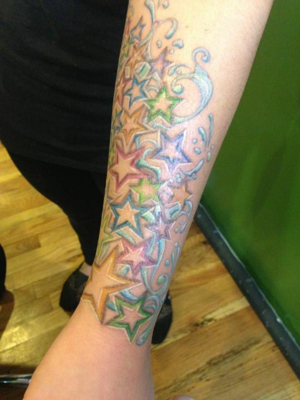 Colored Star Tattoos On Left Forearm