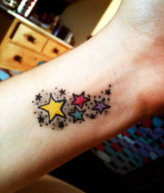 Colored Star Tattoos On Left Wrist