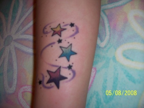 Colored Three Star Tattoos On Arm