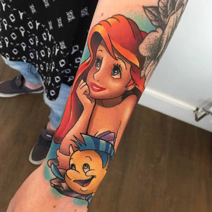 Colorful Cute Little Mermaid With Fish Tattoo On Left Arm
