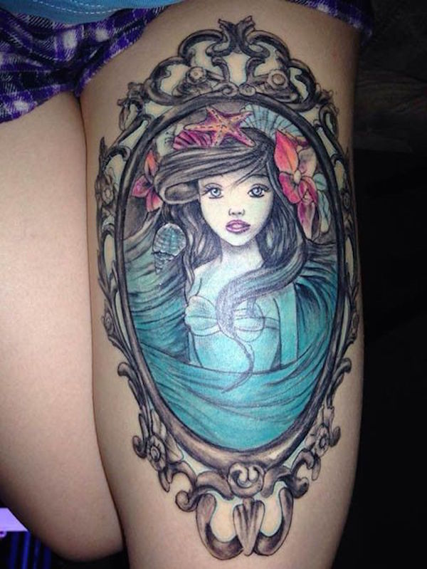 Colorful Mermaid In Frame Tattoo On Girl Left Thigh
