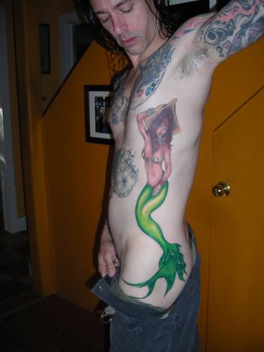 Colorful Pin Up Mermaid Tattoo On Man Left Side Rib