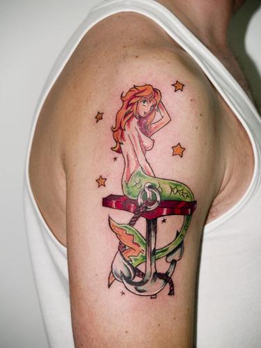 Colorful Pin Up Mermaid With Anchor Tattoo On Right Shoulder