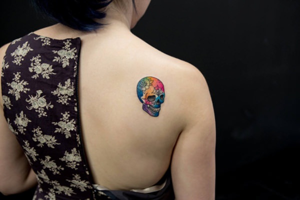 Colorful Pirate Skull With Crossbone Tattoo On Girl Right Back Shoulder