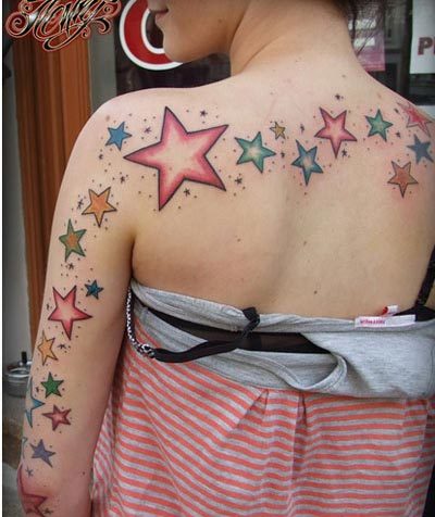 Colorful Star Tattoos On Left Sleeve And Upper Back