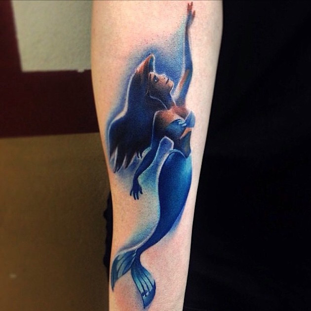 Colorful Swimming Mermaid Tattoo On Forearm