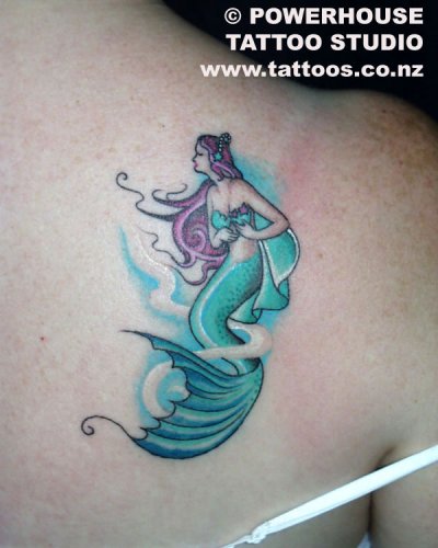 Colorful Swimming Mermaid Tattoo On Girl Right Back Shoulder