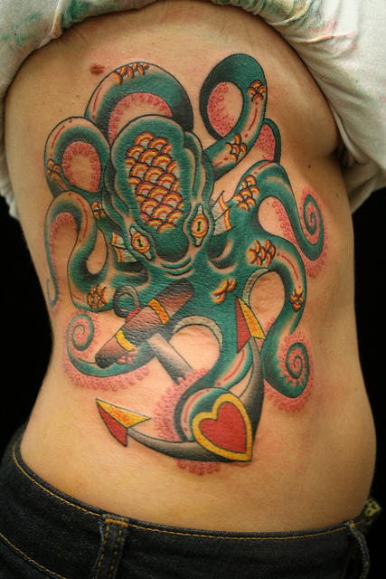 Colorful Traditional Octopus With Anchor Tattoo On Side Rib