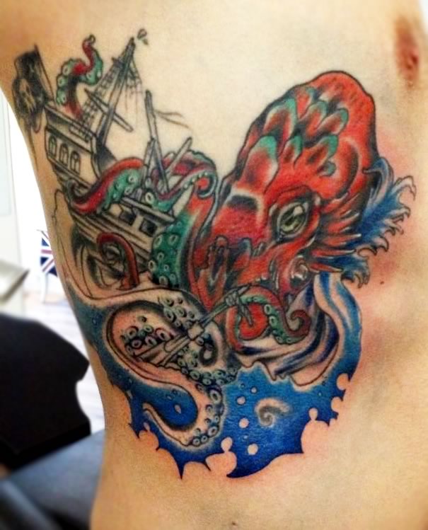 Colorful Traditional Octopus With Ship Tattoo Design For Side Rib
