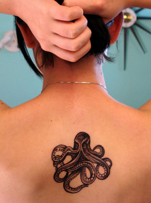 Cool Black Ink Octopus Tattoo On Girl Upper Back