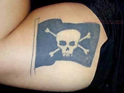 Cool Black Ink Pirate Flag Tattoo On Bicep