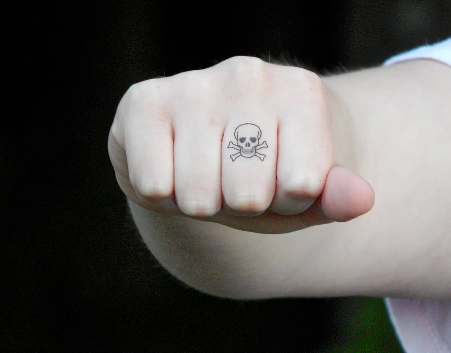 Cool Black Outline Pirate Skull With Crossbone Tattoo On Right Hand Finger