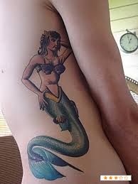 Cool Pin Up Mermaid Tattoo On Right Side Rib