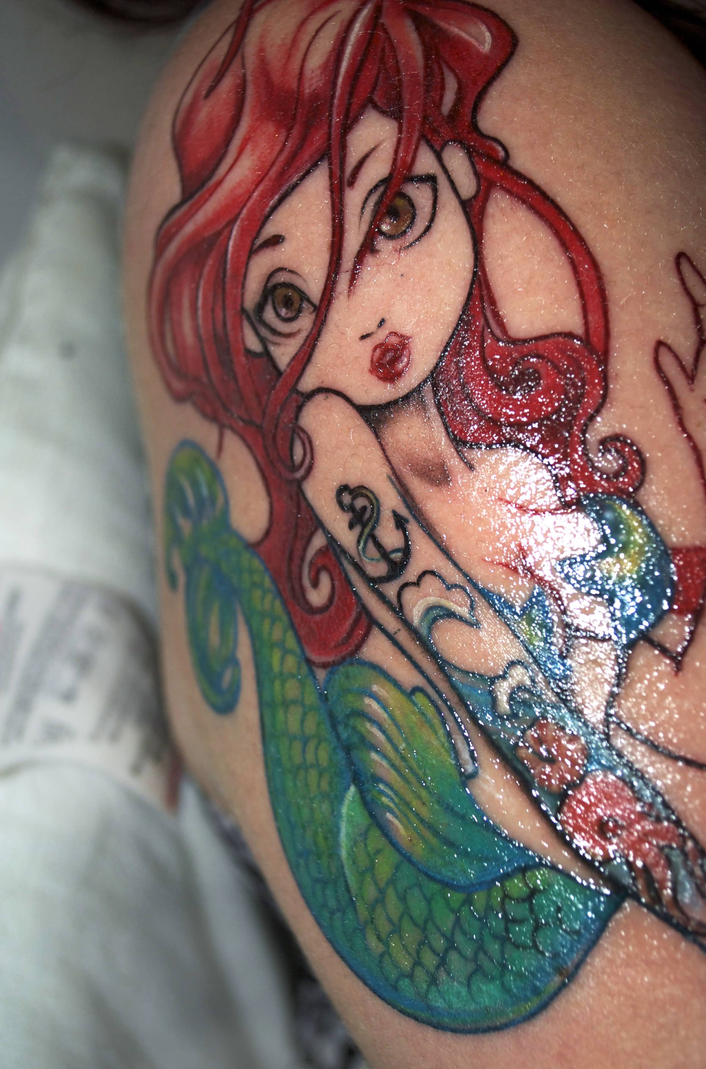 Cute Colorful Swimming Mermaid Tattoo On Right Shoulder