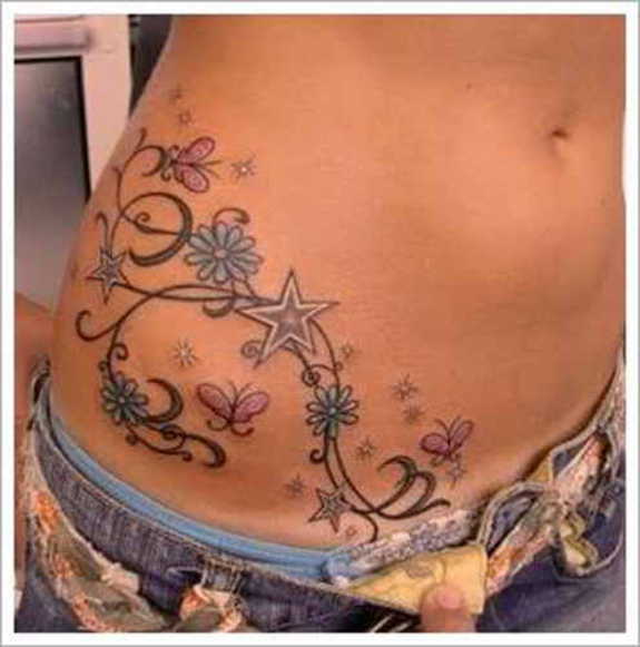 Daisy Flowers And Star Tattoos On Hip