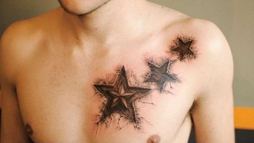 Dark Ink Ripped Skin Star Tattoo On Man Chest