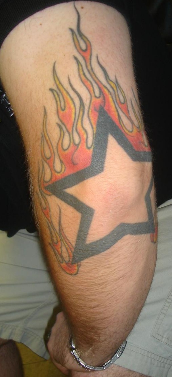 Flaming Star Tattoo On Elbow For Men