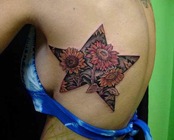 Floral Star Tattoo On Girl Side Rib