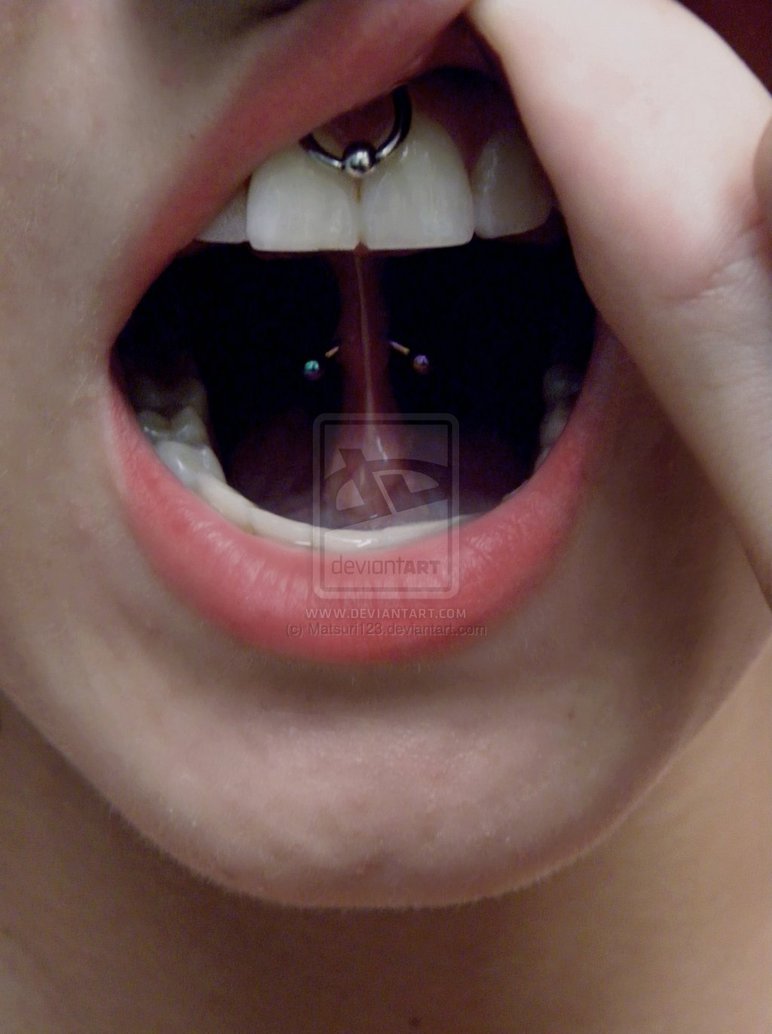 Girl Showing Her Upper lip Frenulum And Curved Barbell Web Piercing