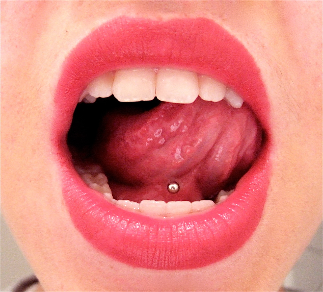 Girl Showing Webbing Piercing With Silver Barbell