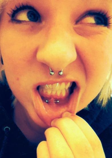 Girl With Lip Frenulum, Septum And Smiley Piercing