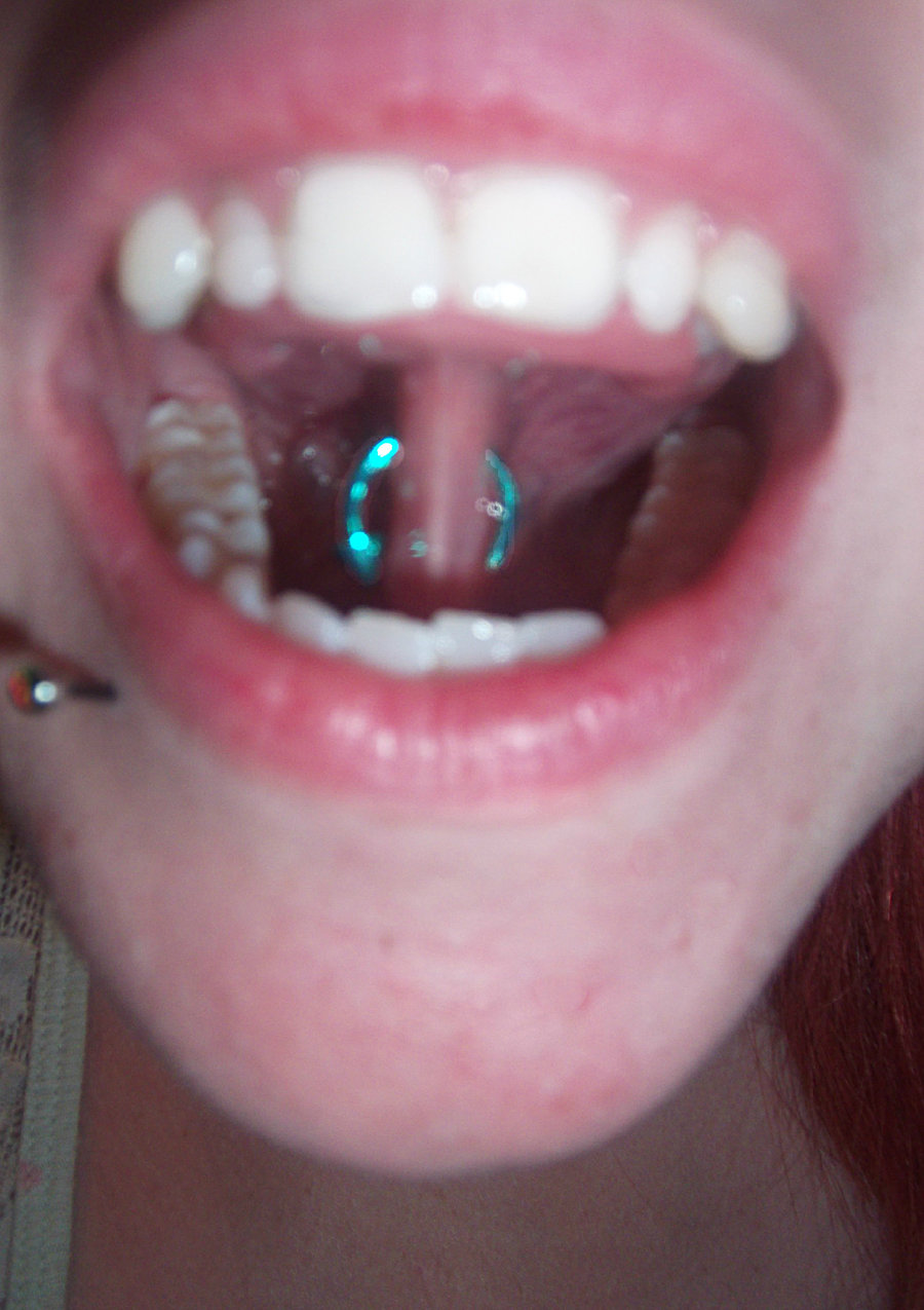 Girl With Lower Lip And Tongue Web Piercing