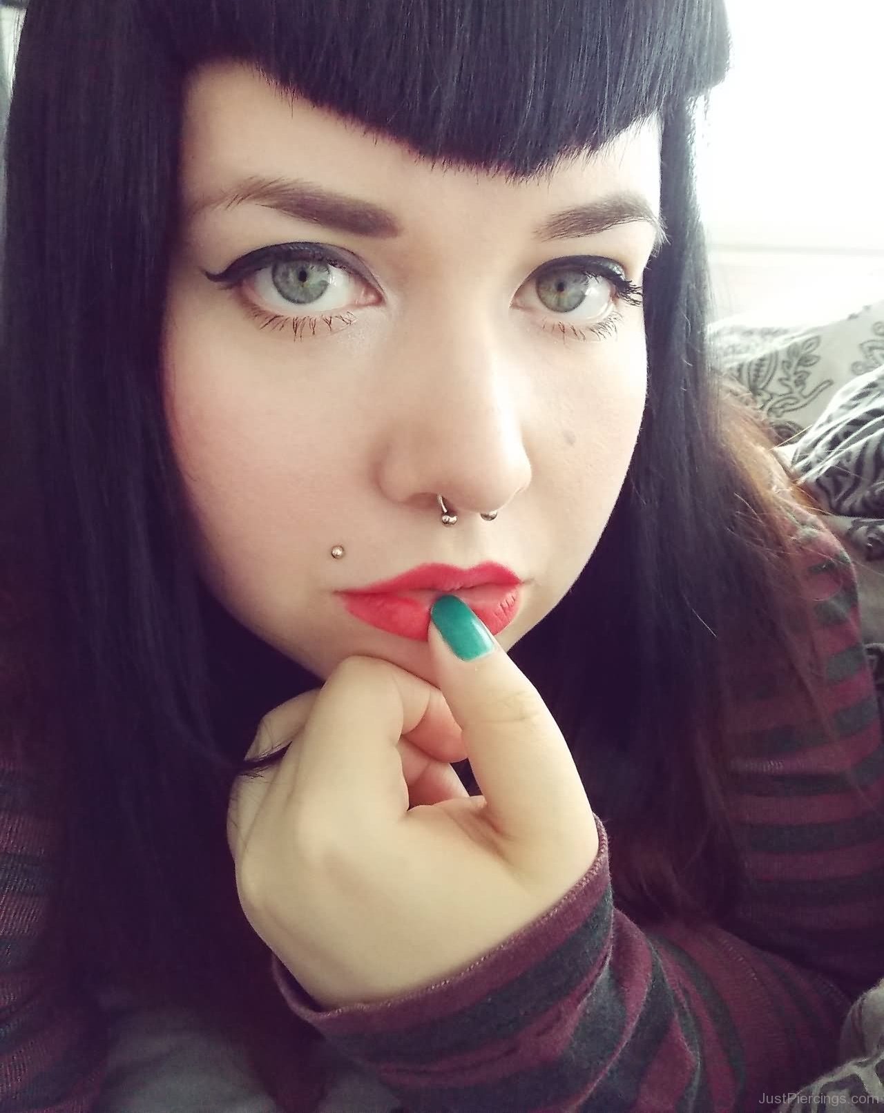 Girl With Septum And Madonna Piercing