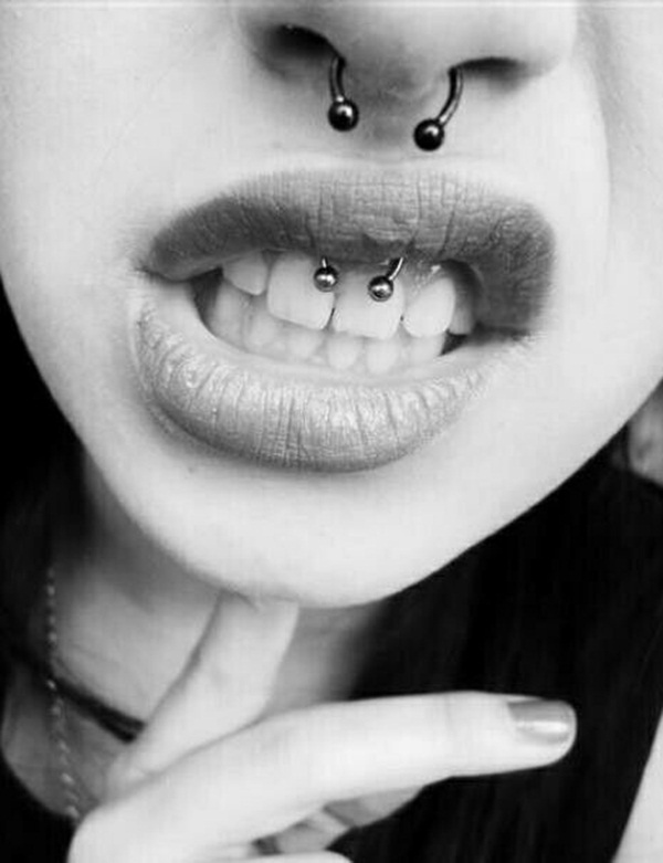 Girl With Smiley And Septum Piercings