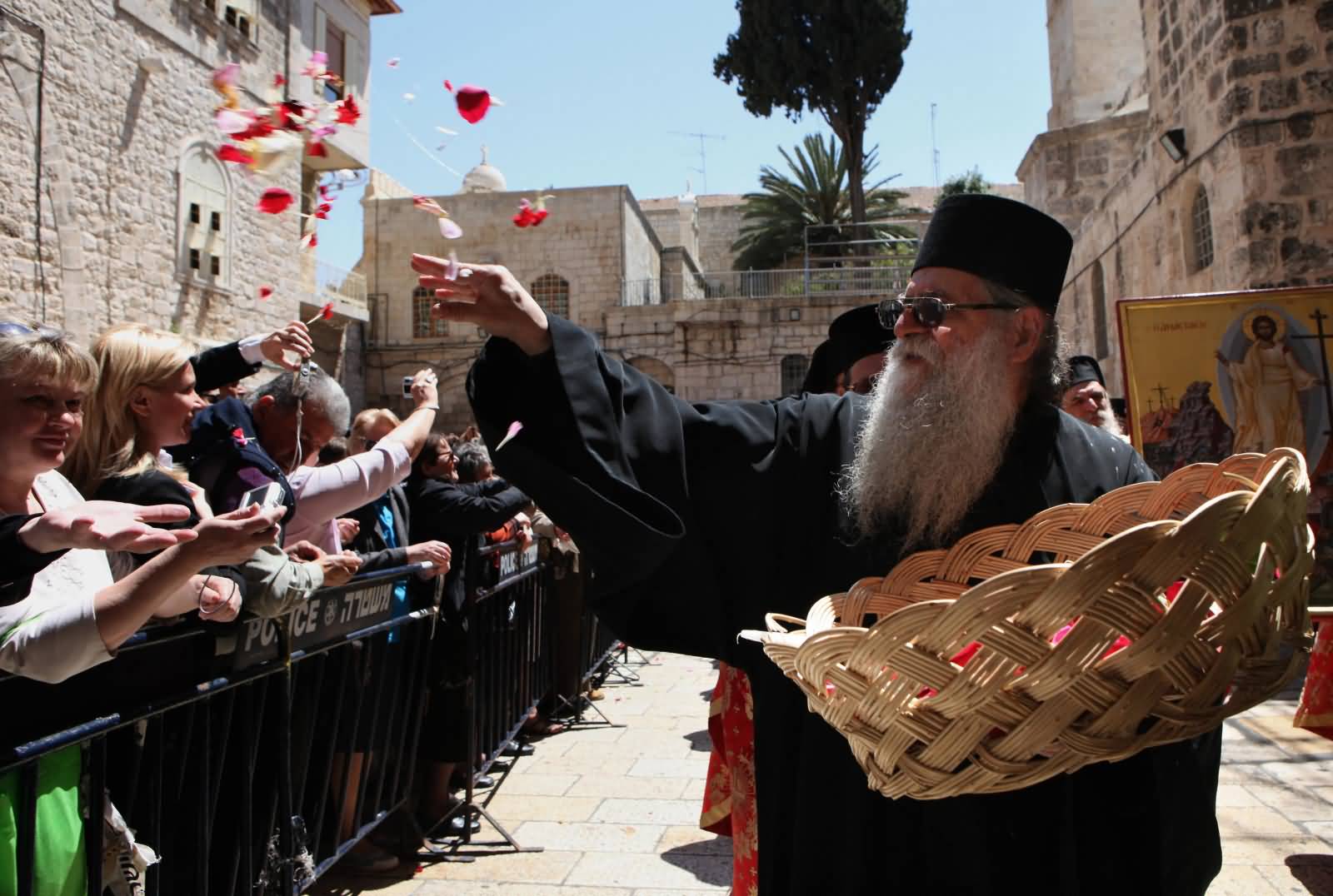 Greek Orthodox Priest Scatters Rose Petals During Holy Saturday