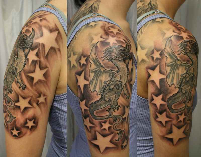 Grey Ink Dragon And Star Tattoos On Arm