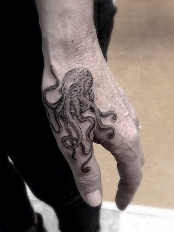 Grey Ink Small Octopus Tattoo On Hand
