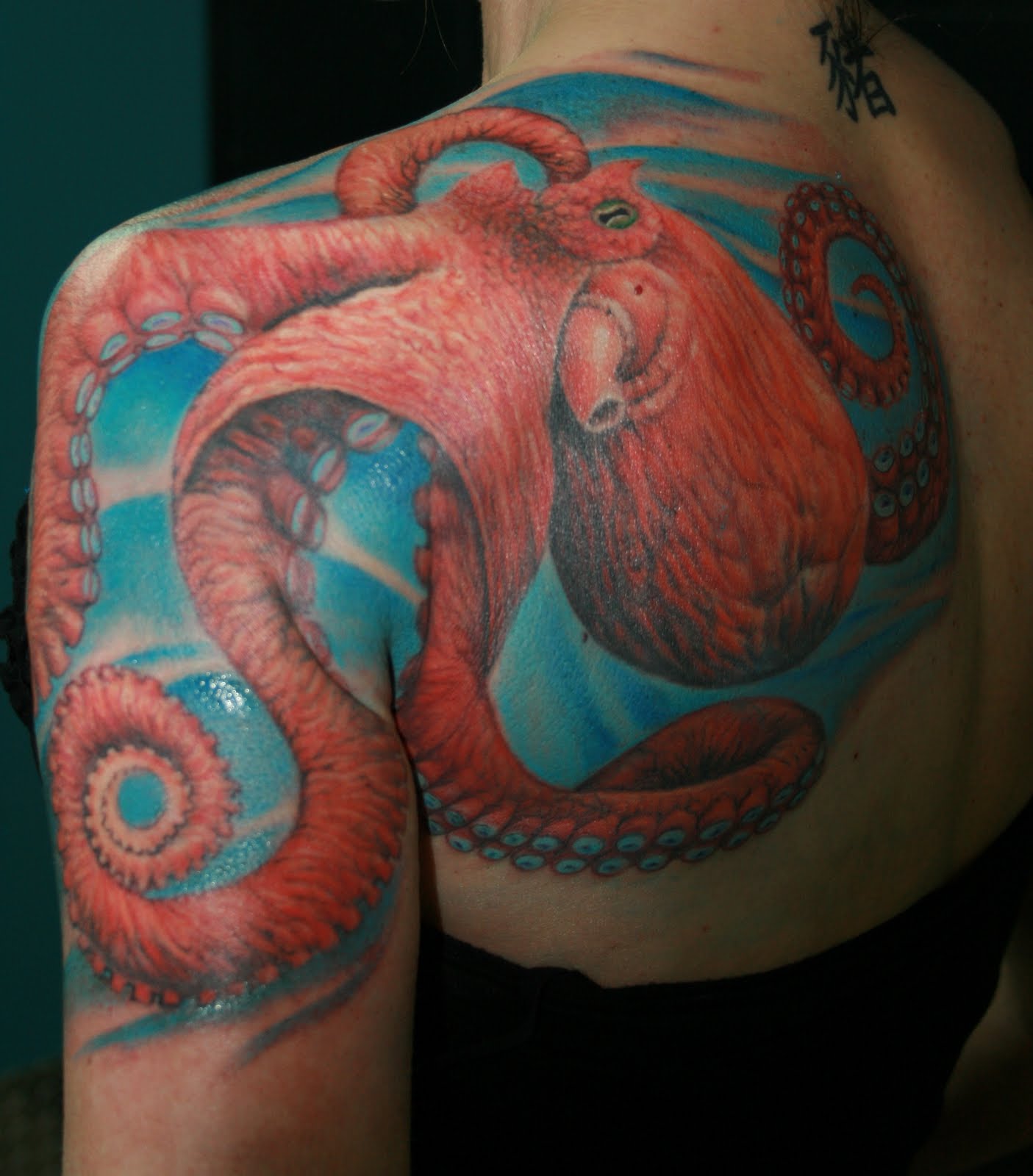 Realistic Octopus Tattoo On Left Back Shoulder