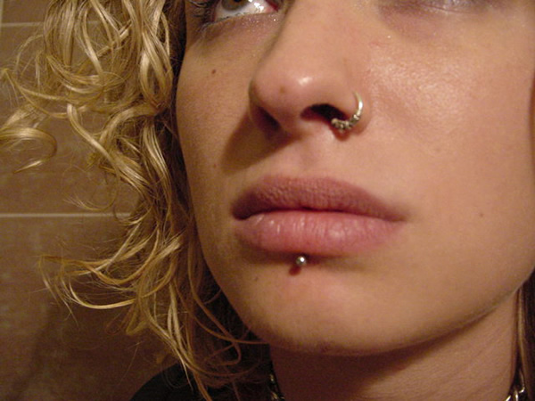 Left Nostril And Labret Piercing With Silver Stud