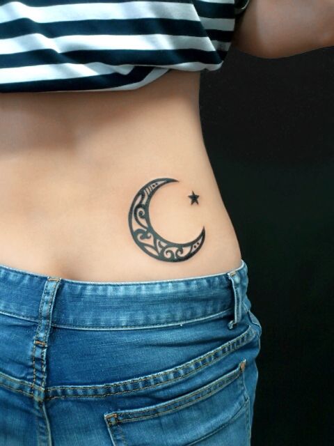 Moon And Star Tattoo On Lower Back