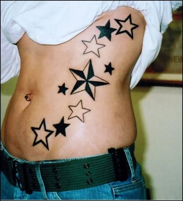 Nautical Star And Black Star Tattoos On Hip