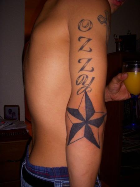 Nautical Star Tattoo On Man Right Elbow