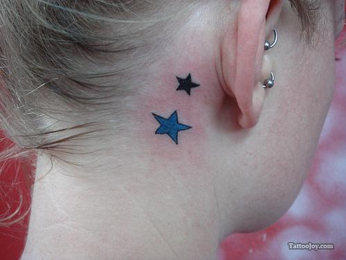 Nice Black And Blue Star Tattoos Behind The Ear